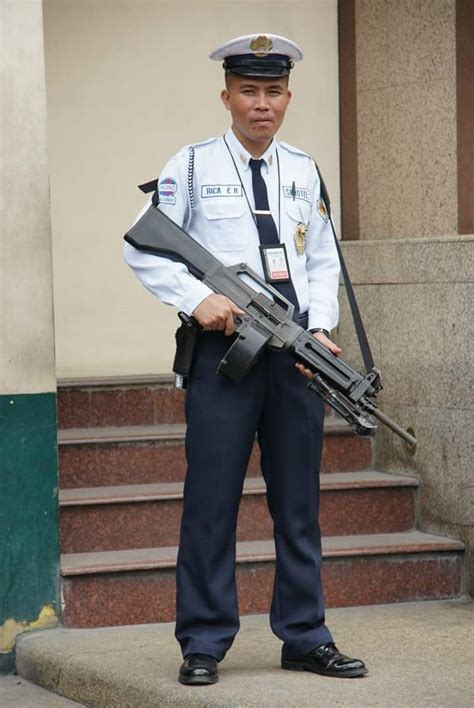 University Security Guard in the Philippines armed with a USAS-12 with ...