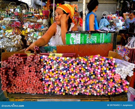 Asian Street Vendor Selling Colored Candles Outside of Quiapo Church in ...