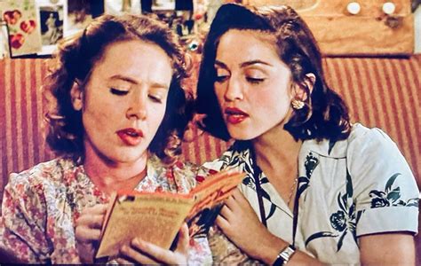 Shirley Baker (Ann Cusack) gets a reading lesson from Mae Mordabito (Madonna), A League of Their ...