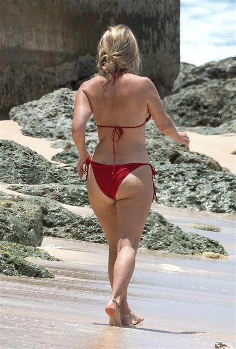 ALICE EVE in a Red Bikini at a Beach in Barbados 09/06/2023 – HawtCelebs