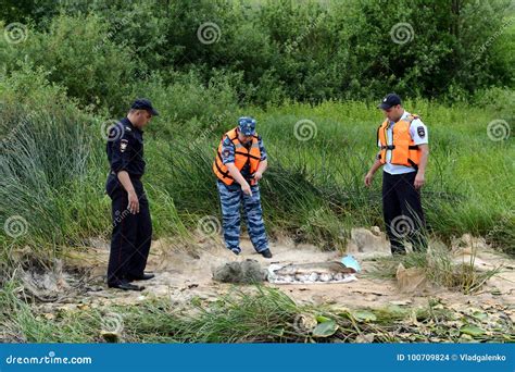 Police Officers Take Out Fish from a Fisherman for Poaching on the Oka River. Editorial Stock ...