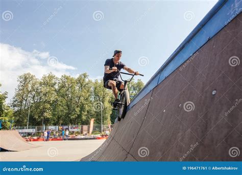 Freestyle. BMX Rider Slides on Bike on Ramp in Skate Park Stock Image ...