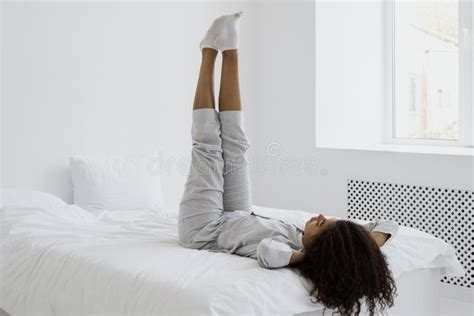 115 Woman Lying Bed Raised Legs Up Photos - Free & Royalty-Free Stock ...