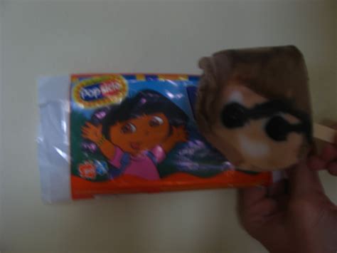 someone is holding up a toy that looks like dora from the movie dora's ...