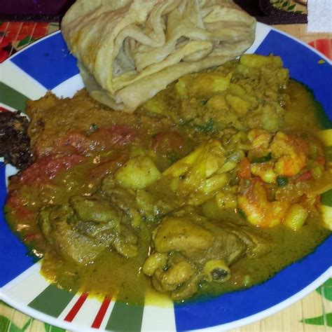 Roti and curry chicken | Healthy eating snacks, Jamaican recipes, Trini food