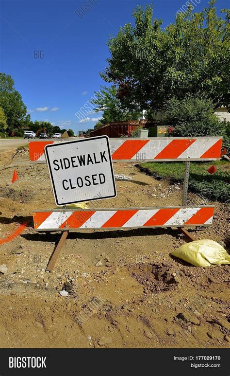 "Sidewalk Closed" sign warning motorists of construction as repair work is in progress Stock ...