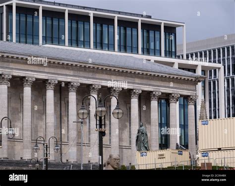 Old and new architecture in the centre of Birmingham. On the left is the Town HAll in front of a ...