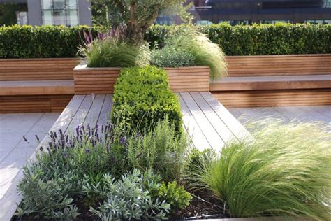 Integrated benches and planters made from Iroko timber - London roof ...