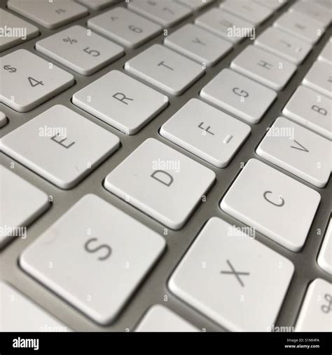 Apple IMac computer keyboard Stock Photo - Alamy