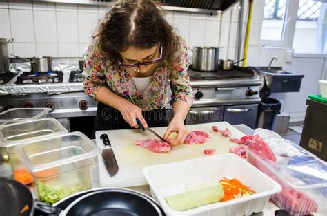 Woman cutting meat stock image. Image of professional - 53091869