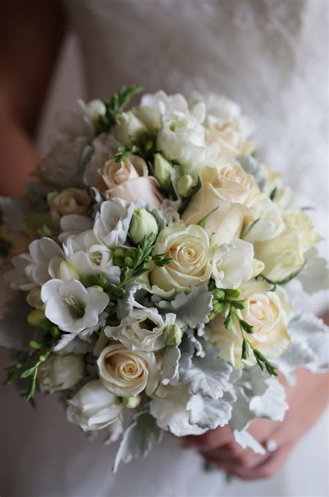 Cream & white bridal bouquet using freesias, roses & lisianthus | Cream wedding flowers, White ...