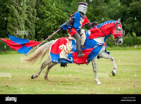 Medieval knight on a horse with flag Stock Photo - Alamy