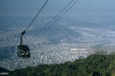 A cable car rises up a mountain, Caracas 1962. (Teleférico del Ávila) : r/vzla