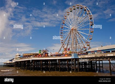 The central pier and ferris wheel on Blackpool sea front are popular ...