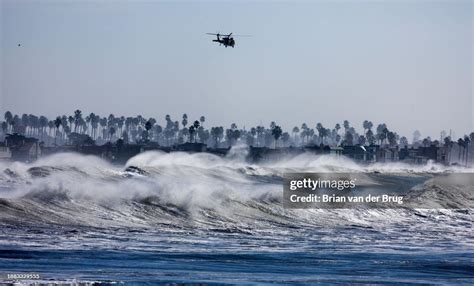 Ventura County fire helicopter patrols the coastline over heavy surf ...