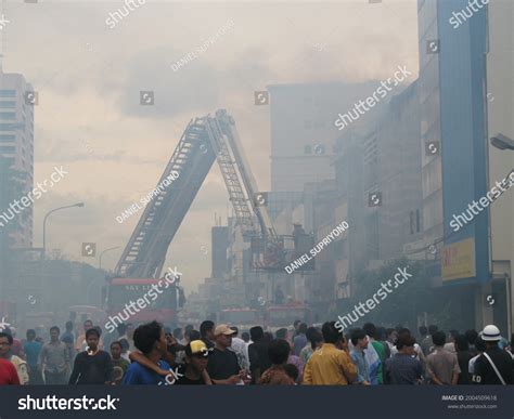 Fire Truck Spraying Water On Burning Stock Photo 2004509618 | Shutterstock