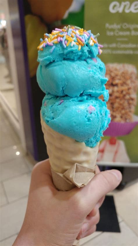 [I Ate] Double scoop bubblegum ice cream in a white chocolate dipped cone topped with sprinkles ...