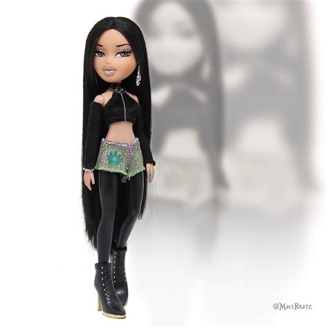 a doll with long black hair is standing in front of a white background ...