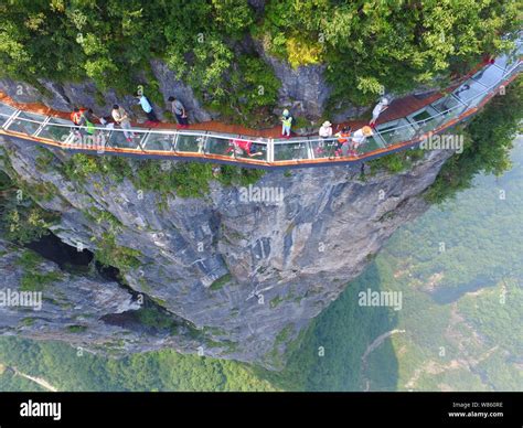 Aerial view of the 100-meter-long and 1.6-meter-wide glass skywalk on the cliff of Tianmen ...