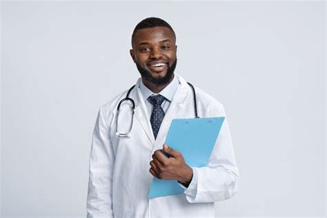 Portrait of Positive Black Doctor Holding Medical Chart Stock Image ...