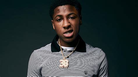 NBA Youngboy Is Wearing Black White Striped T-Shirt In Green Background ...