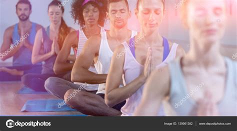 Group of people performing yoga Stock Photo by ©Wavebreakmedia 139561382