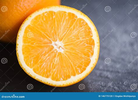 Fresh Orange Fruit Slice Half Dark Background Stock Photo - Image of juice, green: 146775120