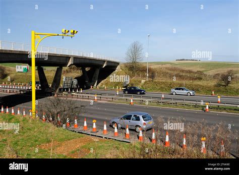 Average speed cameras at roadworks on the M4 motorway Stock Photo - Alamy