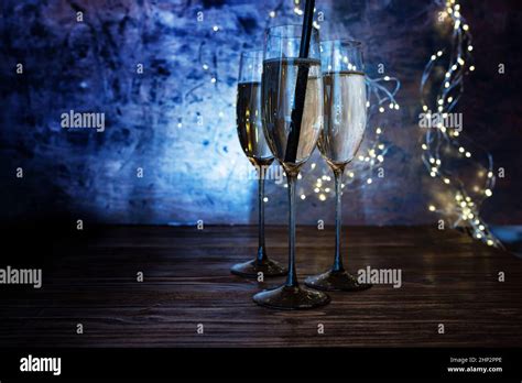New year celebration with sparkeling champagne. Champagne glasses with ...