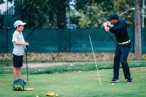 Golf â€“ Personal Training. Golf Instructor Teaching Young Boy How To ...