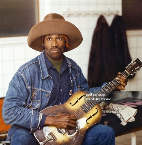 Photo of TAJ MAHAL; Portrait of blues musician Taj Mahal, with guitar ...