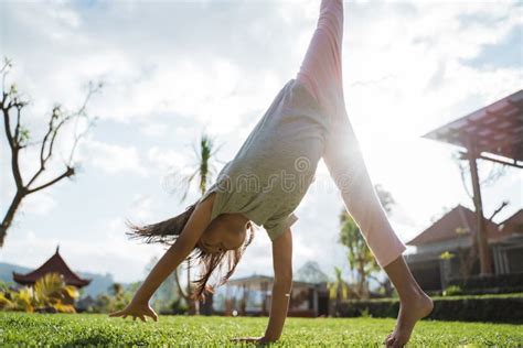 Little Girl Enjoyed Playing Somersault in the Garden Stock Image - Image of fresh, cute: 204766415