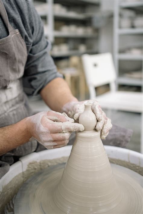 Photo of a Person's Hands Shaping Clay · Free Stock Photo