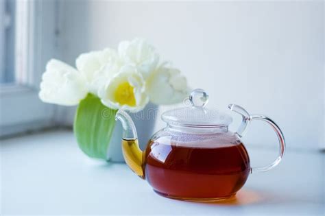 Tea pot and flowers stock image. Image of beverage, flower - 13174907