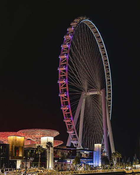 A ferris wheel at night photo – Free Dubai Image on Unsplash