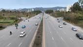 Islamabad Highway Traffic Flowing On The Road View Of Green Mountains Centaurus Mall Stock Video ...
