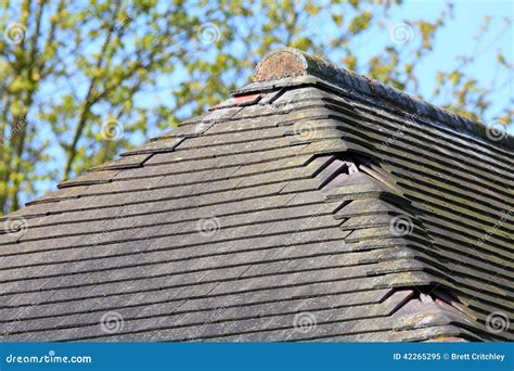 Missing damaged roof tiles stock image. Image of tile - 42265295