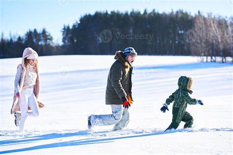 Nice happy family having fun on winter snow 15877264 Stock Photo at ...