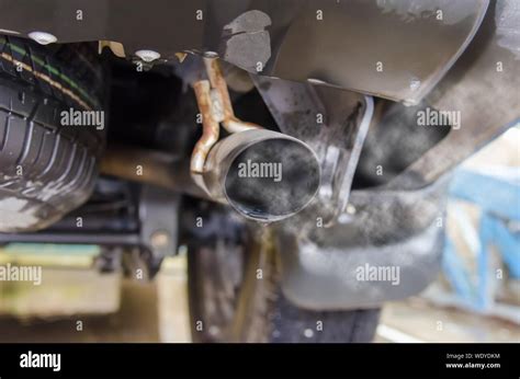 Car exhaust while leaving a smoke Stock Photo - Alamy