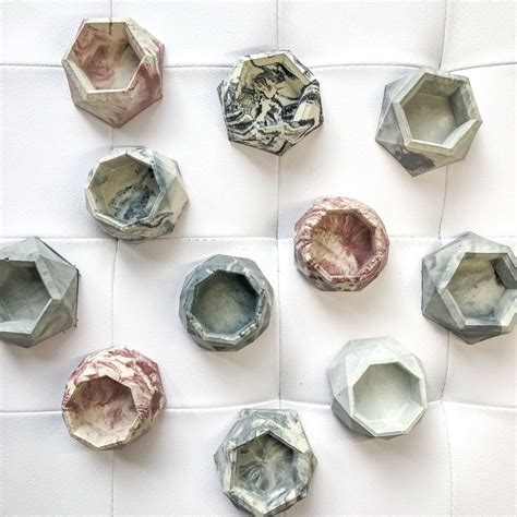 several different shapes and sizes of hexagonal objects on a white surface, including one in the ...