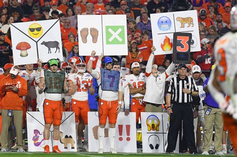 Why Do College Football Teams Hold up Signs for the Offense?