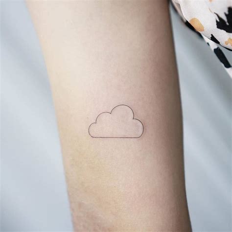 Inner arm minimalist cloud tattoo.