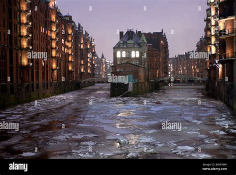 Frozen canals during winter in Speicherstadt historic warehouse district in Hamburg Germany ...