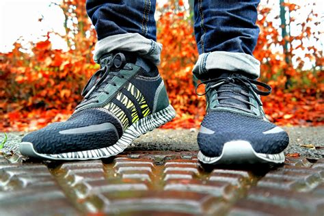 Shallow Focus Photography of Pair of Black Black-and-white Adidas Running Shoes · Free Stock Photo