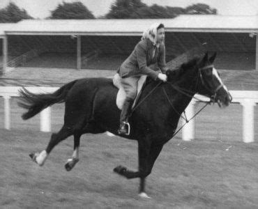 Queen Elizabeth II riding on the racecourse before the opening of the third day of the Royal ...