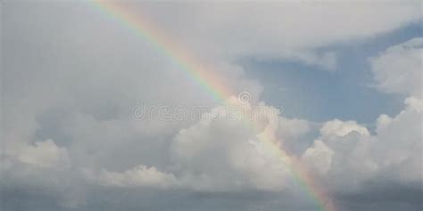 Rainbow in the clouds stock photo. Image of rainbow - 153628610