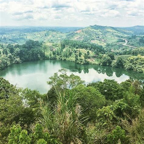 Crater lakes near Fort Portal. In the distance lies Kibale Forest, home ...