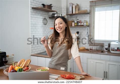 Young Asian Girl Cooking Her Kitchen Stock Photo 2254748607 | Shutterstock