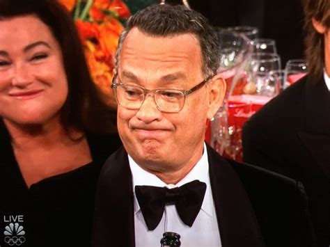 Tom Hanks looks less than impressed with Ricky Gervais' Golden Globes ...