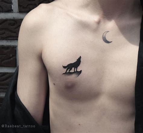 A small black howling wolf tattoo on the right side of the chest | Wolf tattoo, Howling wolf ...